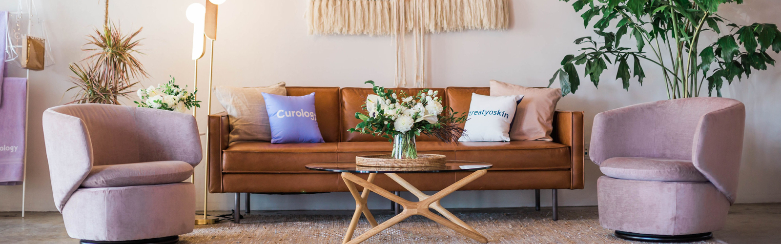 A living room with two chairs and a couch