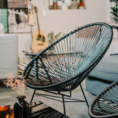 A acapulco chair in a living room